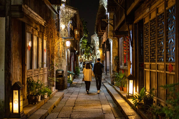 A couple walking in the ancient Chinese village Wuzhen stock photo