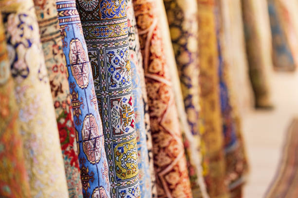 Colorful carpets in silk factory store , Samarkand , Uzbekistan. Colorful carpets in silk factory store , Samarkand , Uzbekistan.  Shallow depth of field, copy space uzbekistan stock pictures, royalty-free photos & images