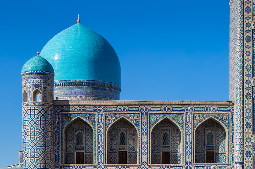 Fragment of architecture Tilya Kori Madrasah (Islamic religious schools) -one of three madrasah  at Registan square- main square in historic Samarkand, Uzbekistan