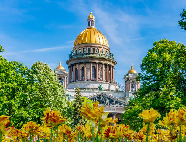 St. Isaac's cathedral and flowers in Alexander garden, Saint Petersburg, Russia stock photo