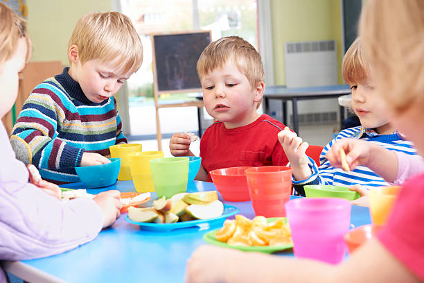 istock Pre School Children Eating Healthy Snacks At Breaktime 147759622