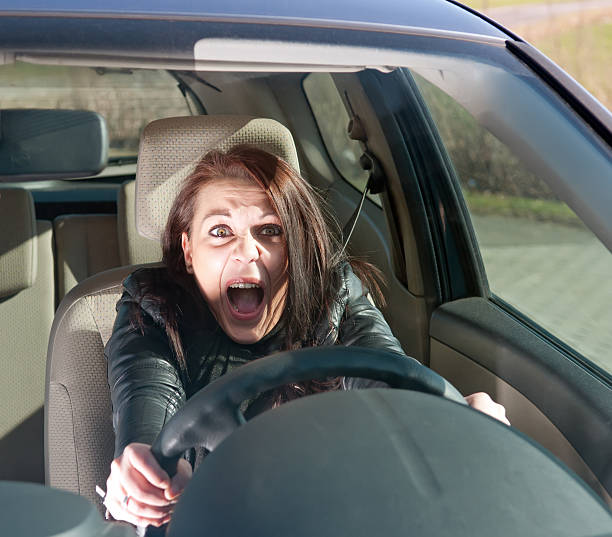 istock young woman screaming in the car 147759932
