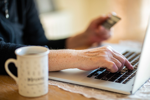 Senior Woman Online Banking With Credit Card On Laptop, Black Friday, Paying Bills