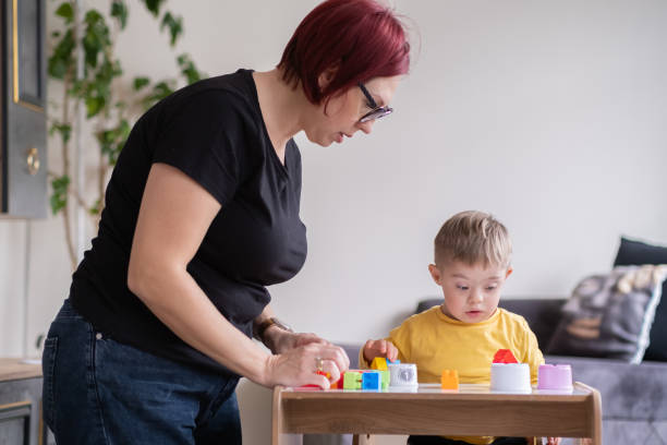 istock Family spending with educational toys, encouraging cognitive development child with Down syndrome 1477603773