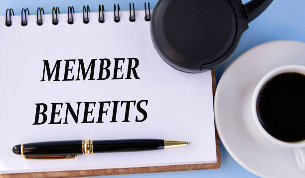 istock MEMBER BENEFITS - words in a white notepad on a light background with a cup of coffee and headphones 1477604024
