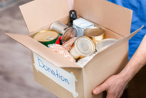istock donation box in male hands 1477604035