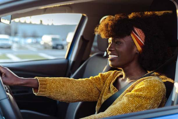istock Cheerful female driver in the car 1477609274
