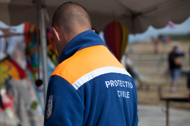 Civil Protection Porspoder, France - July 23 2022: Officer of the 'Protection Civile' (First Responder) during the Esti'vent. french civil protection stock pictures, royalty-free photos & images
