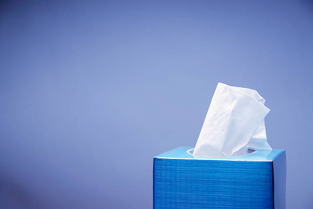 Blue tissue box with white tissue Seasonal Congestion Background with Tissue Box. facial tissue photos stock pictures, royalty-free photos & images