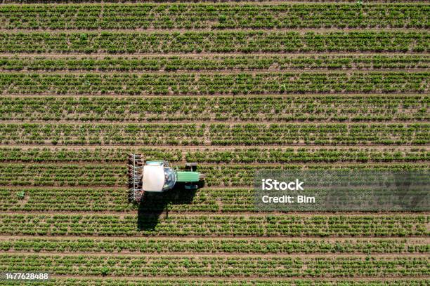 Tractor In The Field From Directly Above Stock Photo - Download Image Now - Aerial View, Farm, Plow