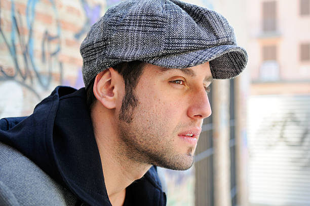 istock Young man in urban background wearing retro cap 147763289