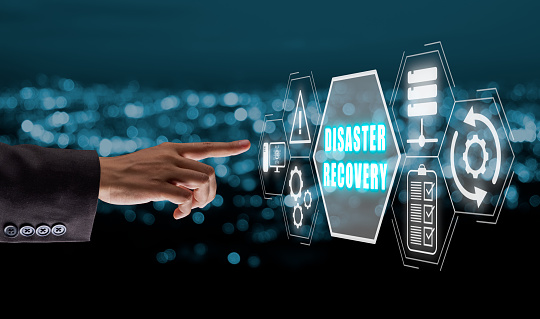 Disaster Recovery concept, Person hand touching disaster recovery icon on virtual screen background, Data loss prevention.
