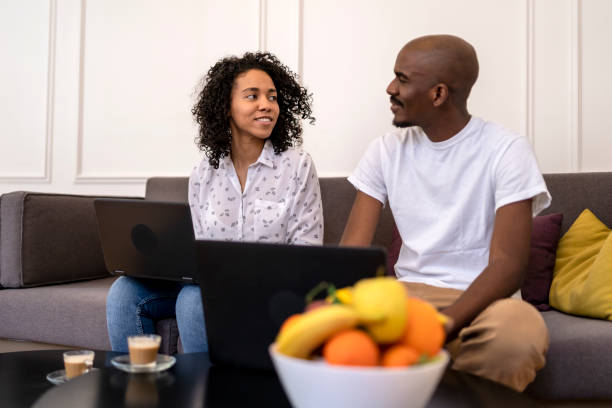 istock African American couple relaxing at home 1477640475