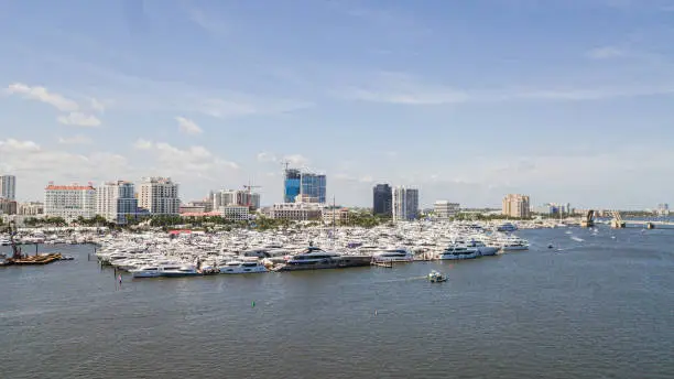 Vibrant Aerial View of the Downtown West Palm Beach, Florida Waterfront Inlet on March 26th, 2023 During Springbreak & the Annual Boat Show at Midday on a Bright Sunny Spring Day
