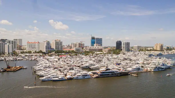 Vibrant Aerial View of the Downtown West Palm Beach, Florida Waterfront Inlet on March 26th, 2023 During Springbreak & the Annual Boat Show at Midday on a Bright Sunny Spring Day