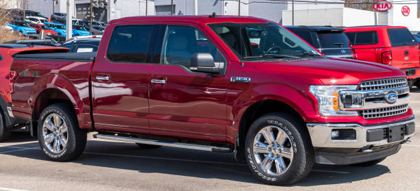 A Ford F150 for sale at a dealership stock photo