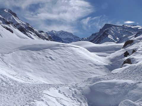 Mountains covered with snow on a sunny day. Copy space.