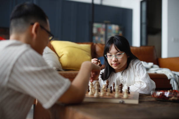 istock Father and daughter playing chess on table at home 1477645181