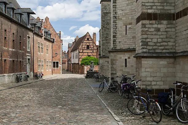 Bicycles parked next to the walls of old houses in Grand Beguinage of Leuven