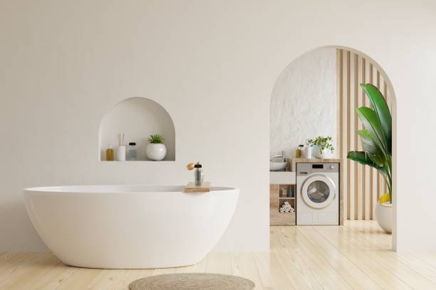 istock Bathroom interior in white room with bathtub and washing machine on white wall.3d rendering 1477649154