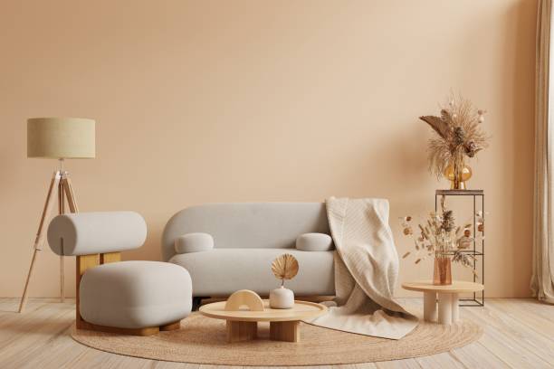 istock Boho style interior with gray sofa and armchair on cream color wall background.3d rendering 1477649244