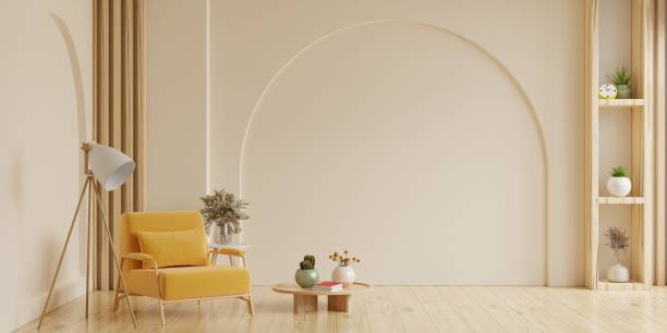 Boho style interior with gray sofa and armchair on cream color wall background.3d rendering