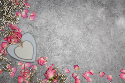 valentine's day gift in a heart-shaped box, mother's day, apples on the table and rose petals. High quality photo