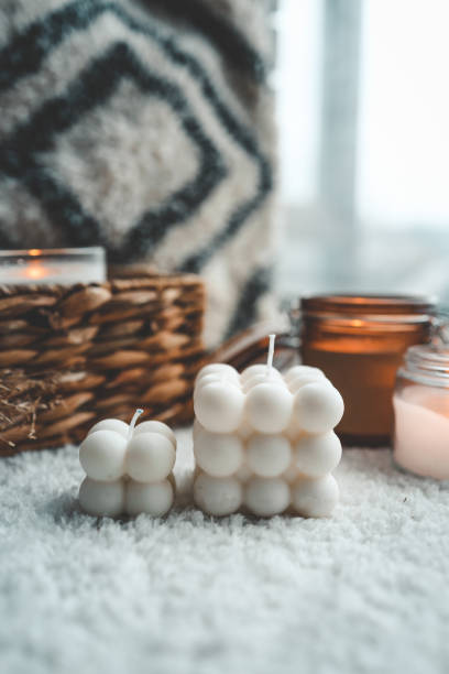 istock Soy handmade candles. Two natural white bubble candles. Decor 1477651174