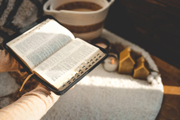 istock Open bible in hands, christian concept 1477651185