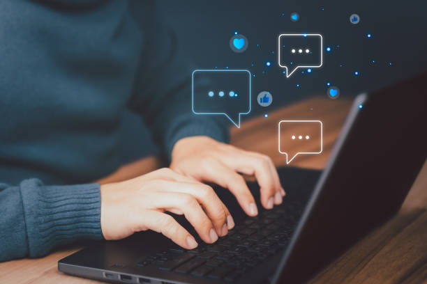 istock Adult man using a computer laptop typing live chat chatting on application communication digital website, Social media application chat box and social network technology concept. 1477651355