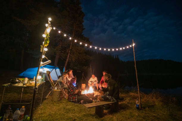istock Friends hanging around the campfire. 1477652735