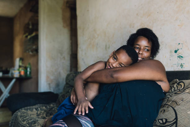 istock Mother and son hugging at home 1477655100