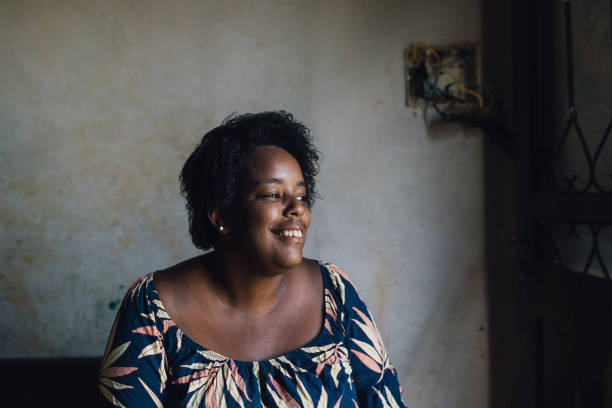 istock Smiling woman at home 1477655139