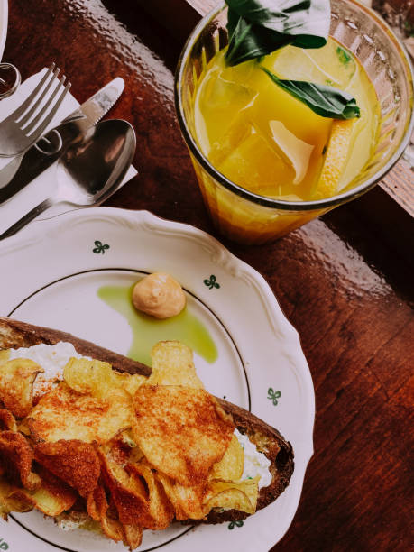 istock Delicious breakfast toast and orange juice on the table in restaurant 1477656524