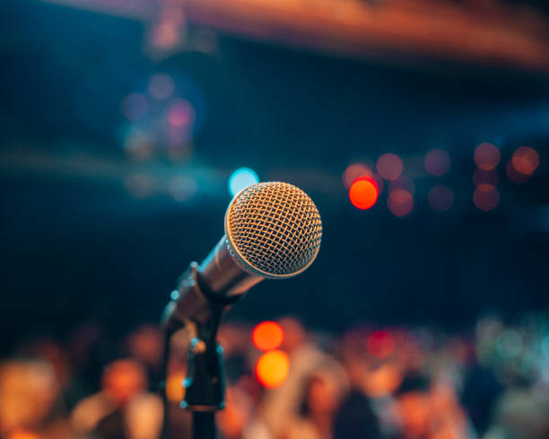istock microphone on stage scene concert music live party 1477656526