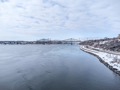 Aerial view of St. Lawrence river and bridges (Quebec and Laporte) in Quebec city during winter day