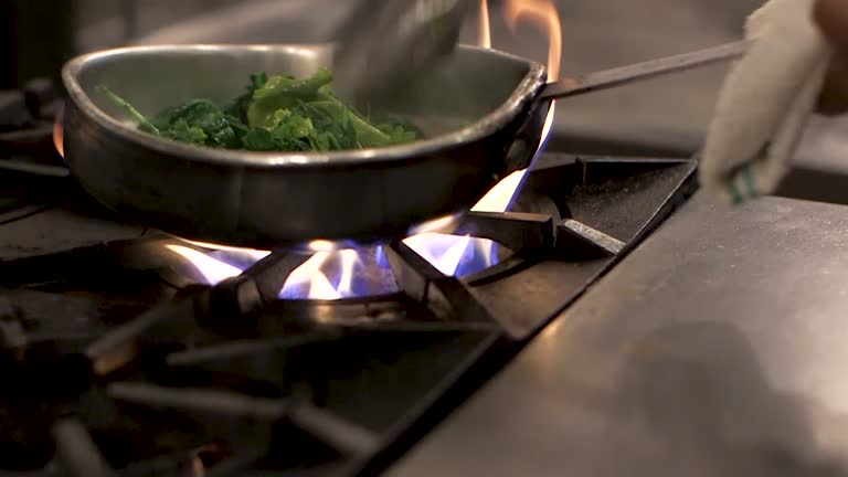 Sautéing Spinach Over a Flaming Stove