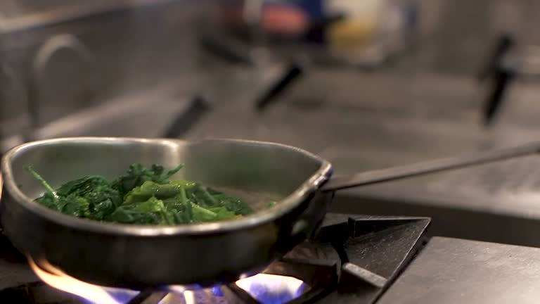 Sautéing Spinach Over a Flaming Stove