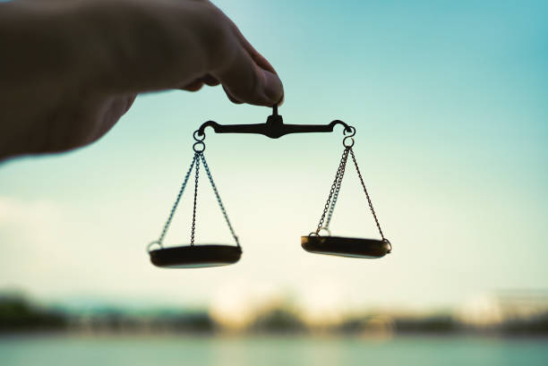 istock person holding scales in the sky 1477665278