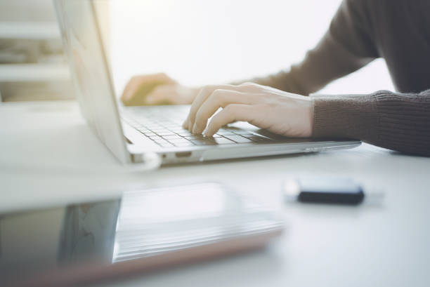 istock Hands of a woman working on a laptop 1477665289