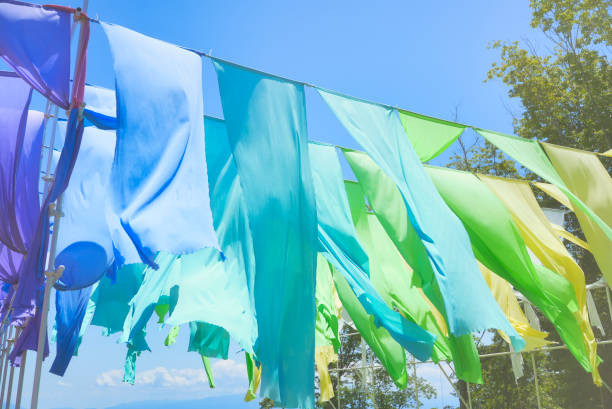 istock blue sky and colorful cloth curtains 1477665302