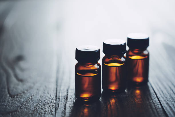 istock Three bottles of aroma on a wood table 1477666408