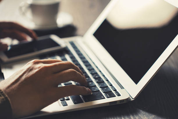 istock Hands of a person working on a laptop 1477666462