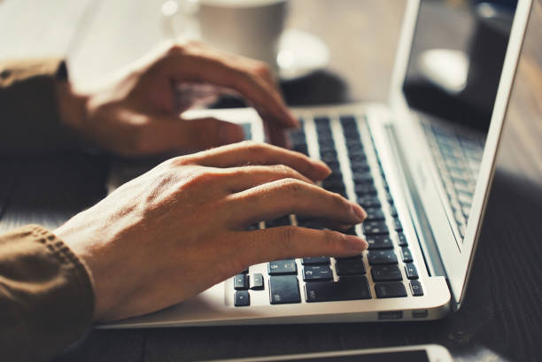 istock Hands of a person working on a laptop 1477666466