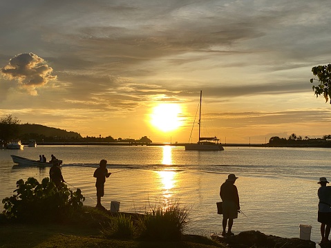 Photo of locals fishing at the beach park