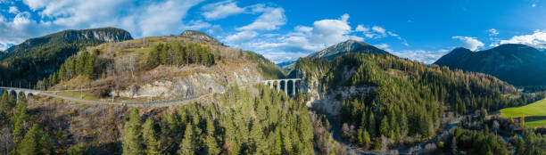 landwasser viaduct glacier and bernina express railway in switzerland winter. - bernina express imagens e fotografias de stock