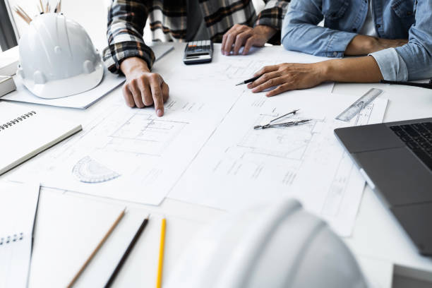 istock Close Up of Team Work of Architect Engineer Design Working on Blueprint Planning Concept. Construction Concept 1477667837