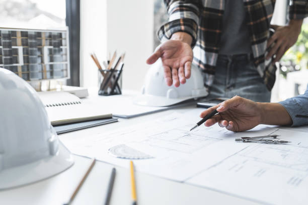 istock Close Up of Team Work of Architect Engineer Design Working on Blueprint Planning Concept. Construction Concept 1477667841