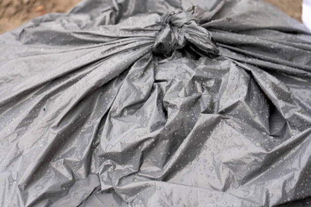 istock trash bag black color garbage waste close up 1477669848