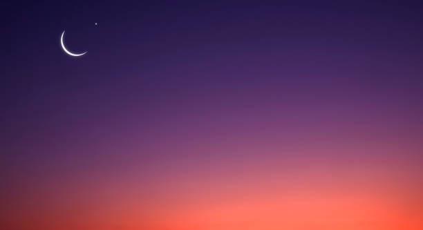 istock Crescent Moon and Star on horizontal Twilight Sky background with beautiful orange sunlight on dark blue evening sky 1477673171